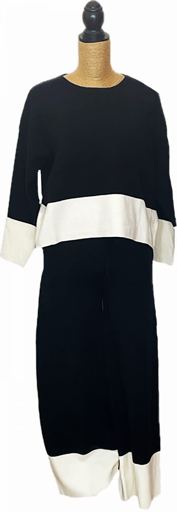 Conjunto jersey y pantalón de punto negro con franja blanca